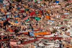 Panoramic urban landscape, the historical old town of Guanajuato city, in Mexico. Colorful, traditional colonial downtown neighborhood houses. Mexican architecture, rooftops, townscape.