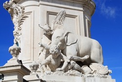 Elephant statue on King Jose I. Monument in Commerce Square in the old town of Lisbon Portugal, Europe. Allegorical limestone sculptures of triumph and fame.
