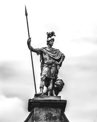 The statue of Fortitude decorating Dublin Castle, Ireland. Black and white background.