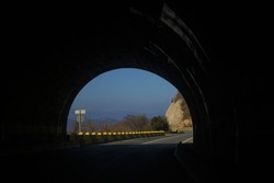 At the exit from the road tunnel. Road tunnel crossing the mountain