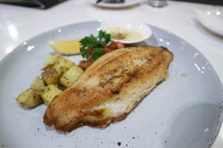 fish steak , catfish steak with white cream sauce and vegetable