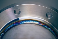Steel weld joined pipe to plate by arc welding process . rainbow color.with copy space