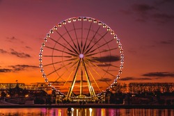  Illuminated Ferris wheel at sunset, Colorful sky and Ferris wheel.