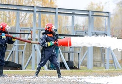Ministry of Emergency Situations.  Foam fire extinguishing. Extinguishing the fire of a railway tank car. Fire safety measures. A fire brigade is working. Belarus