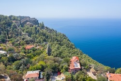 A view from above on the city of Alanya, the Ich Kale fortress and the Cleopatra beach. Fortress on the Chilarda-Burnu peninsula. Mediterranean Sea. Turkey. Aerial photography. Panorama of Alanya