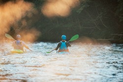 Two whitewater kayakers paddling on the waters of river. Adrenaline seekers and nature lovers.