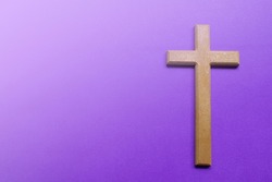 Good Friday, Palm Sunday, Ash Wednesday, Lent Season and Holy Week concept. Cross on purple background.