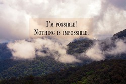 Motivational and inspirational quotes against blurred mountain view background with filler effect - I'm possible, Nothing is impossible.