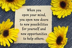 Motivational quote on torn brown paper - When you open your mind, you open new doors to new possibilities for yourself and new opportunities to help others.