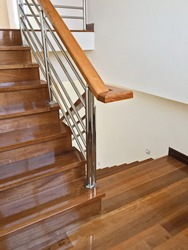 View of elegant glossy wooden stairs in the new house