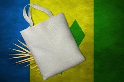 Patriotic tote bag mock up on background in colors of national flag. Saint Vincent and the Grenadines