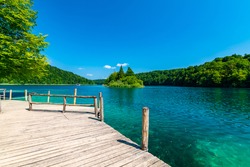 Small harbor at Plitvice lakes, Croatia. Pure blue water in lakes, wooden harbor.