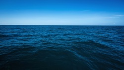 The vast ocean in the winter, Dark and deep ocean with blue sky