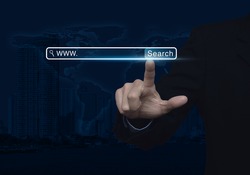 Businessman hand pressing search www button over map and city tower, Searching system and internet concept, Elements of this image furnished by NASA