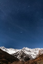 Night stars over snow alps mountain in italy bardonecchia winter time wall paper for phone iphone cellphone