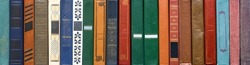 Book texture. Different vintage books in row. Literature, reading concept.