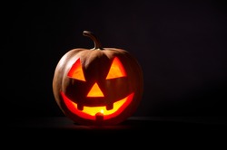 Kind Halloween Pumpkin On A Black Background