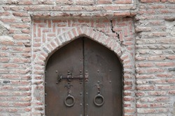 Wrought iron door. metal door in an old medieval temple. medieval background