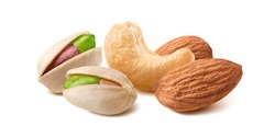 Pistachios, almonds and cashew nuts mix isolated on white background. Package design element with clipping path