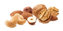 Nuts isolated on white background. Walnut, almond, hazelnut and cashew. Clipping path. Full depth of field