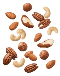 Flying cashew, almond, hazelnut, pecan and brazil nuts falling isolated on white background. Nut mix. Top view. Package design elements with clipping path