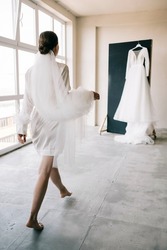 The morning of the bride in the European style. Boudoir dress in the interior Studio. White minimalism for the bride.