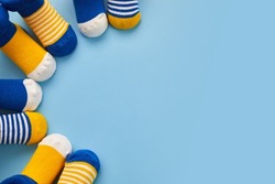 World Down syndrome day background. Down syndrome awareness concept. Socks on blue background