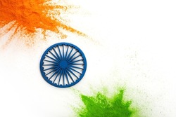 Orange and green color powder splash with Ashoka wheel. Concept for India independence day, 15th of august.