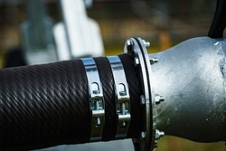 Metal clamps in use, connection hose, detail view