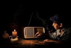boy listens retro radio, in the dark with candle light, horizontal, 30s, 40s, nostalgic moody,