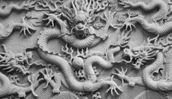 A wall with dragon stone sculpture in fayu temple in mount putuo zhoushan city zhejiang province China.