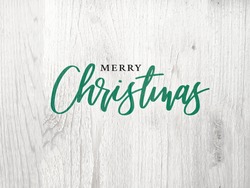Merry Christmas Green Graphic Calligraphy Text Design With White Wood Background
