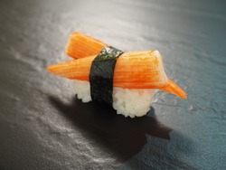 Kanikama Crab sticks nigiri sushi on black stone slate background  japanese food style