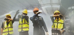 Group workers of men and women covering their noses with their hands for safety, suffocating due to an industrial fire accident. They walked out of the scene consciously before they were harmed.