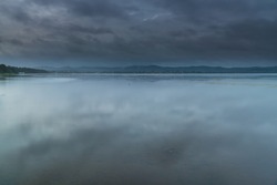 Overcast sunrise over the lake at Long Jetty on the Central Coast of NSW, Australia.