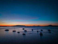 Aerial sunrise with boats on Brisbane Water at Koolewong and Tascott on the Central Coast, NSW, Australia.