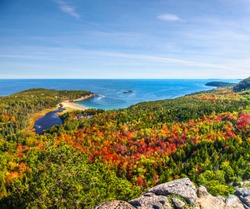 Panoramic view of the stunning fall colors and blue waters of the Bay in Acadia National Park
