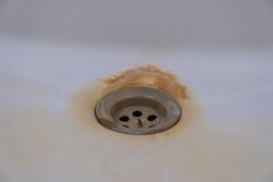 metal drain rusted ceramic sink