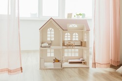 Light Doll house interior miniature. View on children room in pastel neutral colors