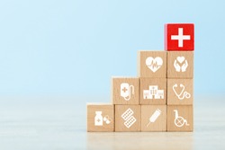 Health Insurance Concept,arranging wood block stacking with icon healthcare medical.