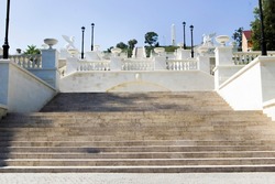 Wide concrete steps. Park landscape. Stone paved stairs in park. Kerch, Crimea.