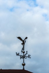Eagle weather vane on a cloudy day