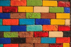 abstract aged multicolored painted baked earthen clay brick blocks, colorful architectural structure design, exterior wall background, wallpaper, backdrop, building decoration, painting, creativity