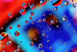Abstract colorful background of oil circles. Oil in the water surface circles, water foam and oil bubbles. High quality photo