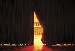 Theater seats through curtains.. behind scene
