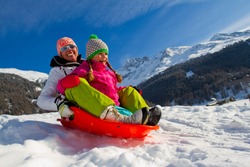 Sledding, winter fun, snow, family sledding at winter time