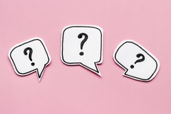 Ask question concept. Question mark on speech bubbles, top view