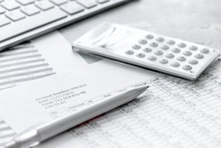 business accounter work with taxes and calculator on white office desk