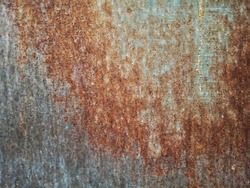 The old metal surface is rusty.  Is a grain film image