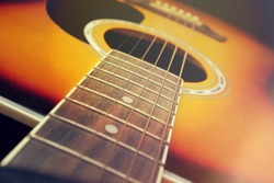 Close up of acoustic guitar, vintage filter.